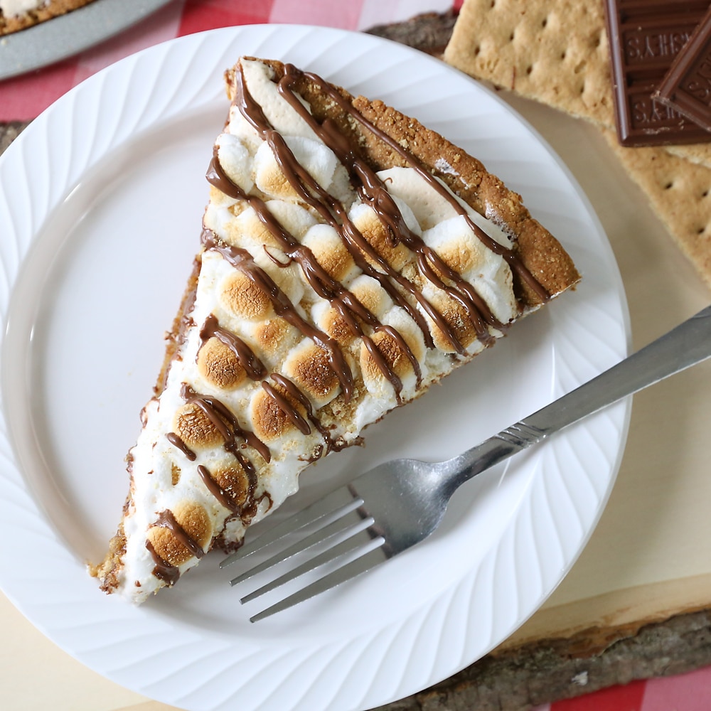 S'more dessert pizza slice on a plate